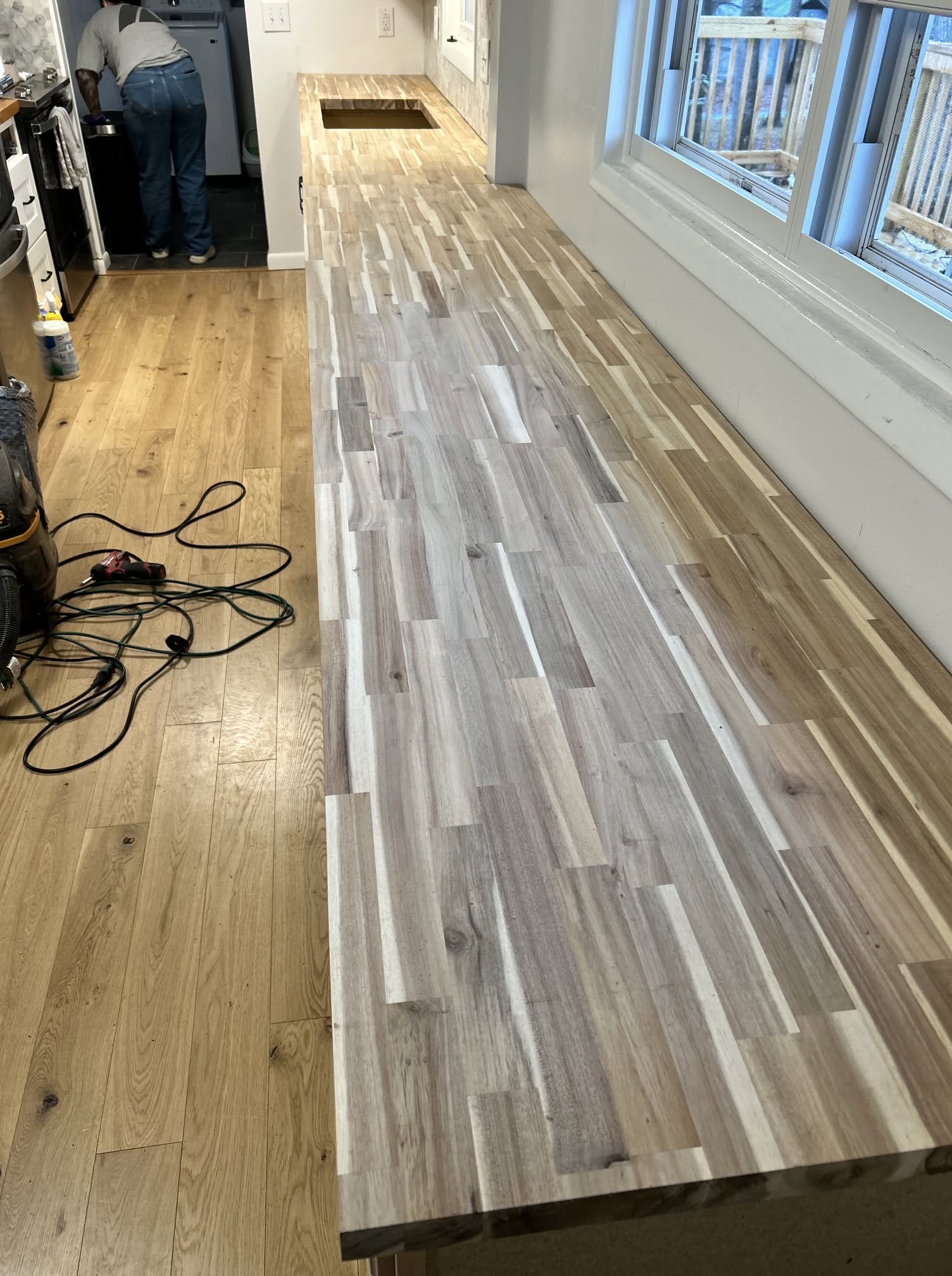 Custom wood countertop beside windows