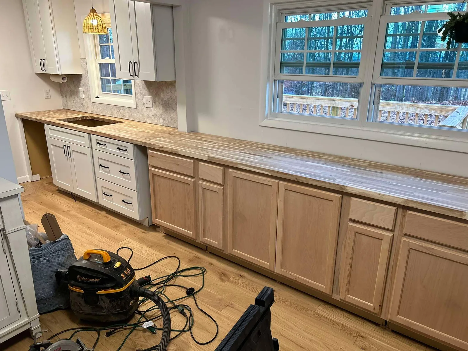 Kitchen cabinet installation and long countertop workspace